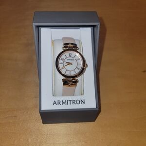 Armitron Gold-Tone Watch with Light Pink Leathwr Strap.